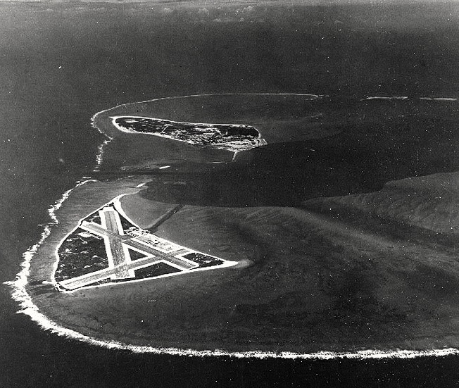 Aerial photograph of Midway Atoll, 24 Nov 1941 Source: United States National Archives Identification Code 80-G-451086 Aerial photograph, looking just south of west across the southern side of the atoll, 24 November 1941. Eastern Island, then the site of Midway's airfield, is in the foreground. Sand Island, location of most other base facilities, is across the entrance channel. Official U.S. Navy Photograph, U.S. National Archives.